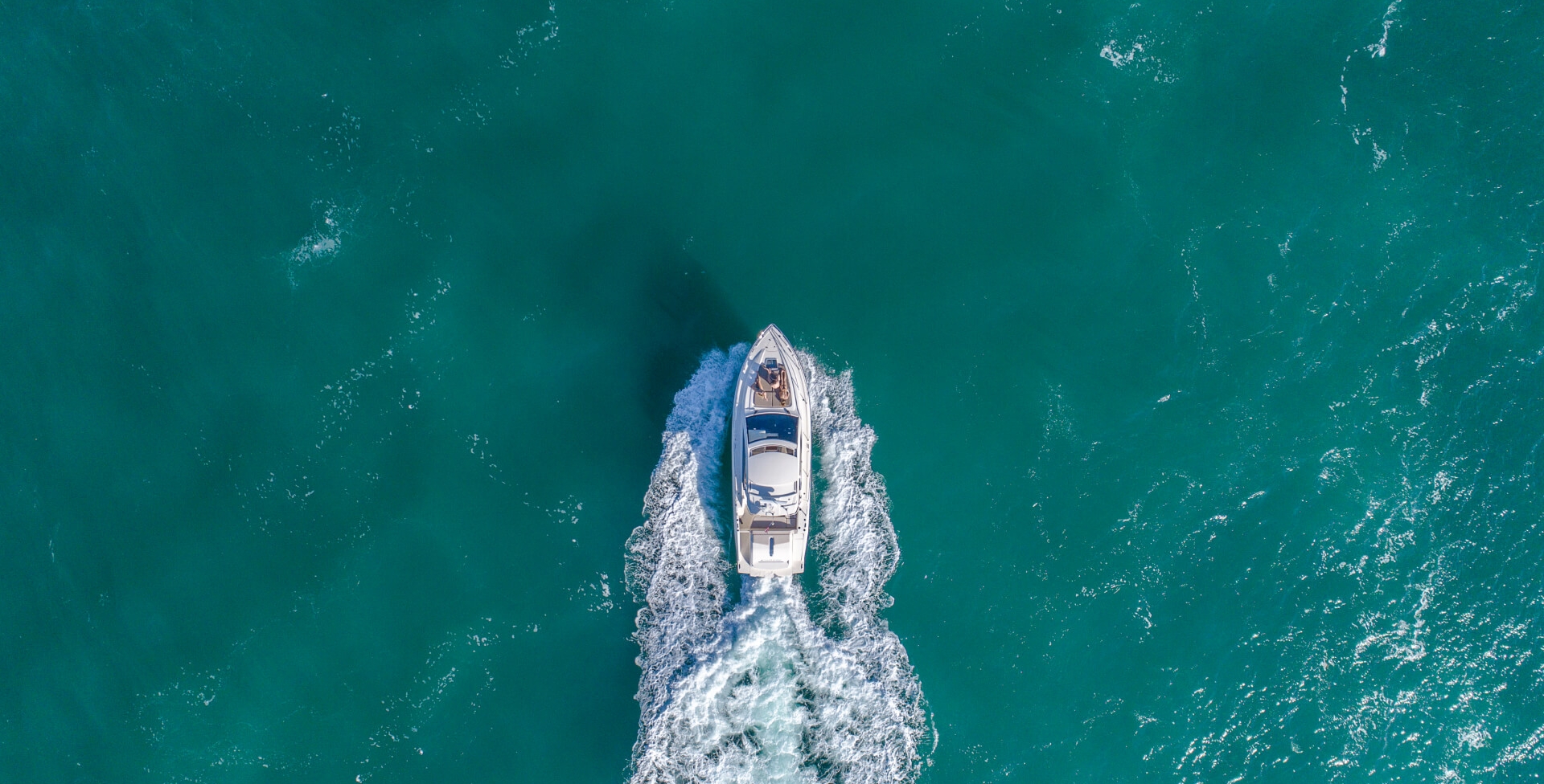 Aerial shot of a boat in the sea